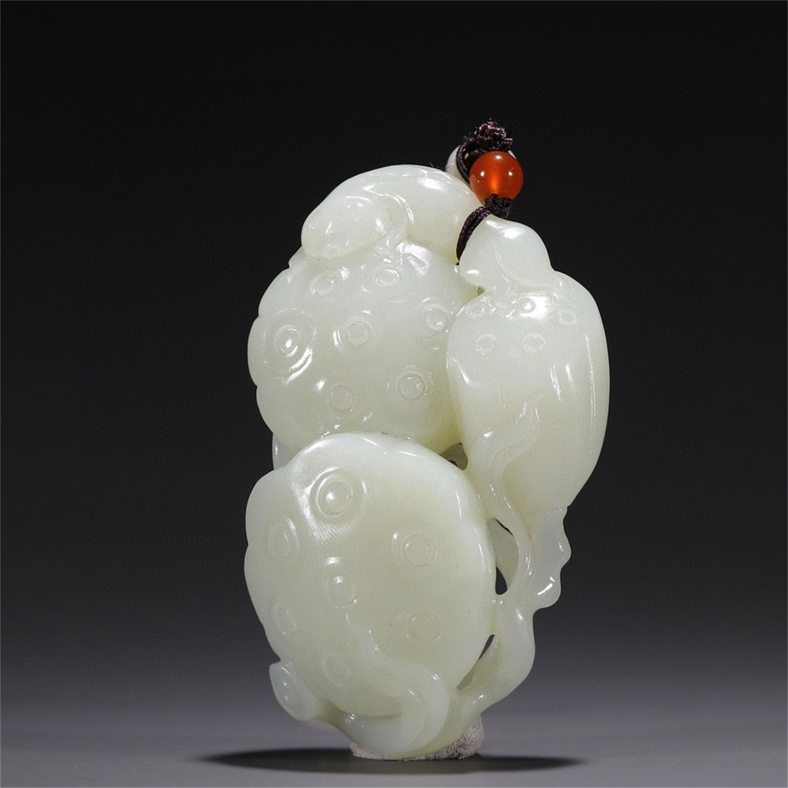 A Chinese Carved Jade Lotus Shaped Pendant (1 of 9)