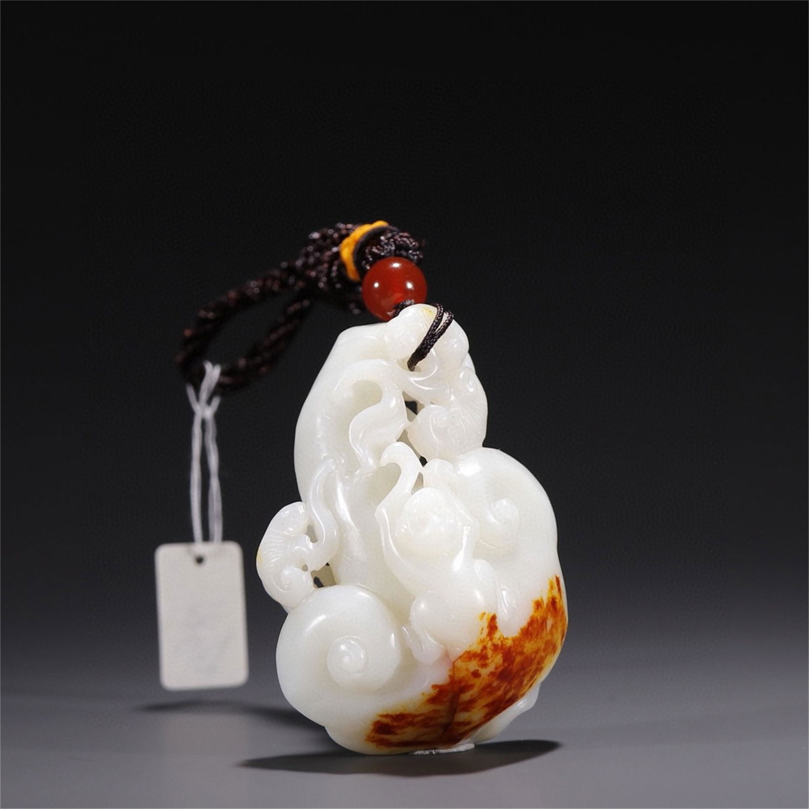 A Chinese Carved Jade Ruyi Pendant (1 of 9)