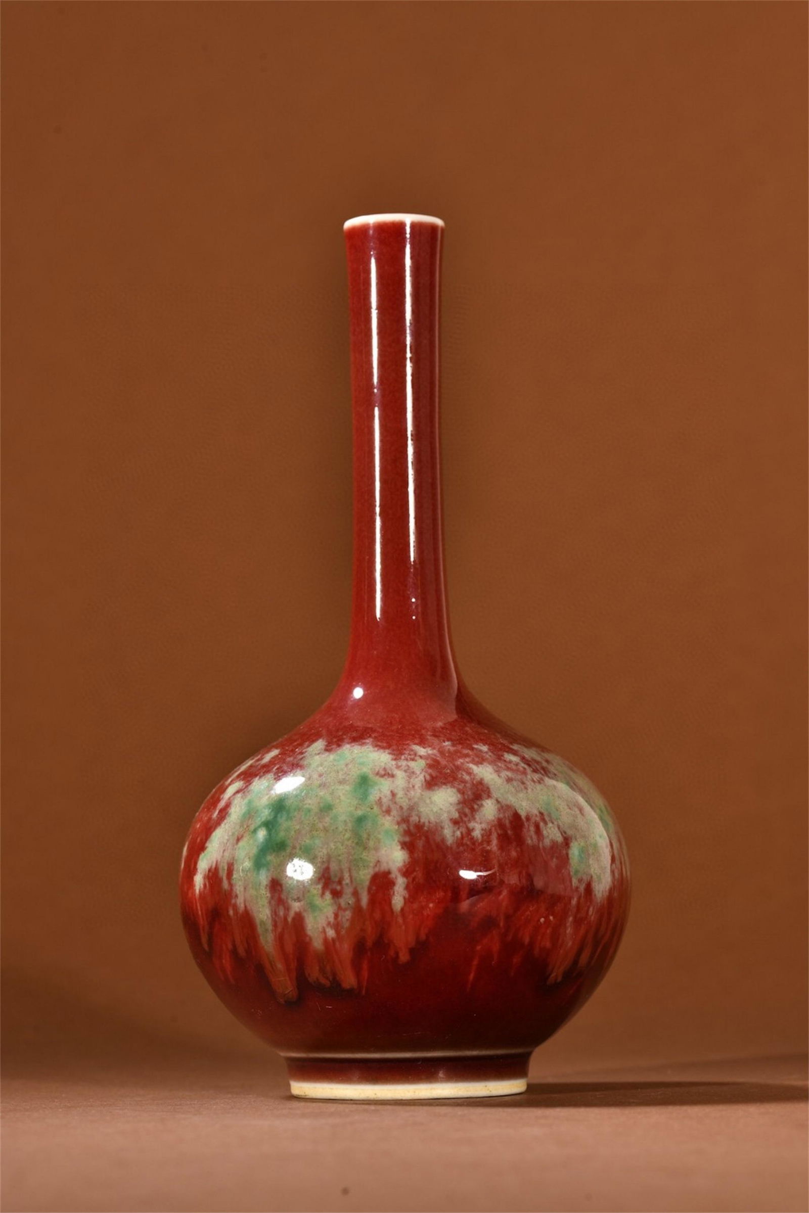 A Chinese Red Glazed Porcelain Long Neck Vase (1 of 9)