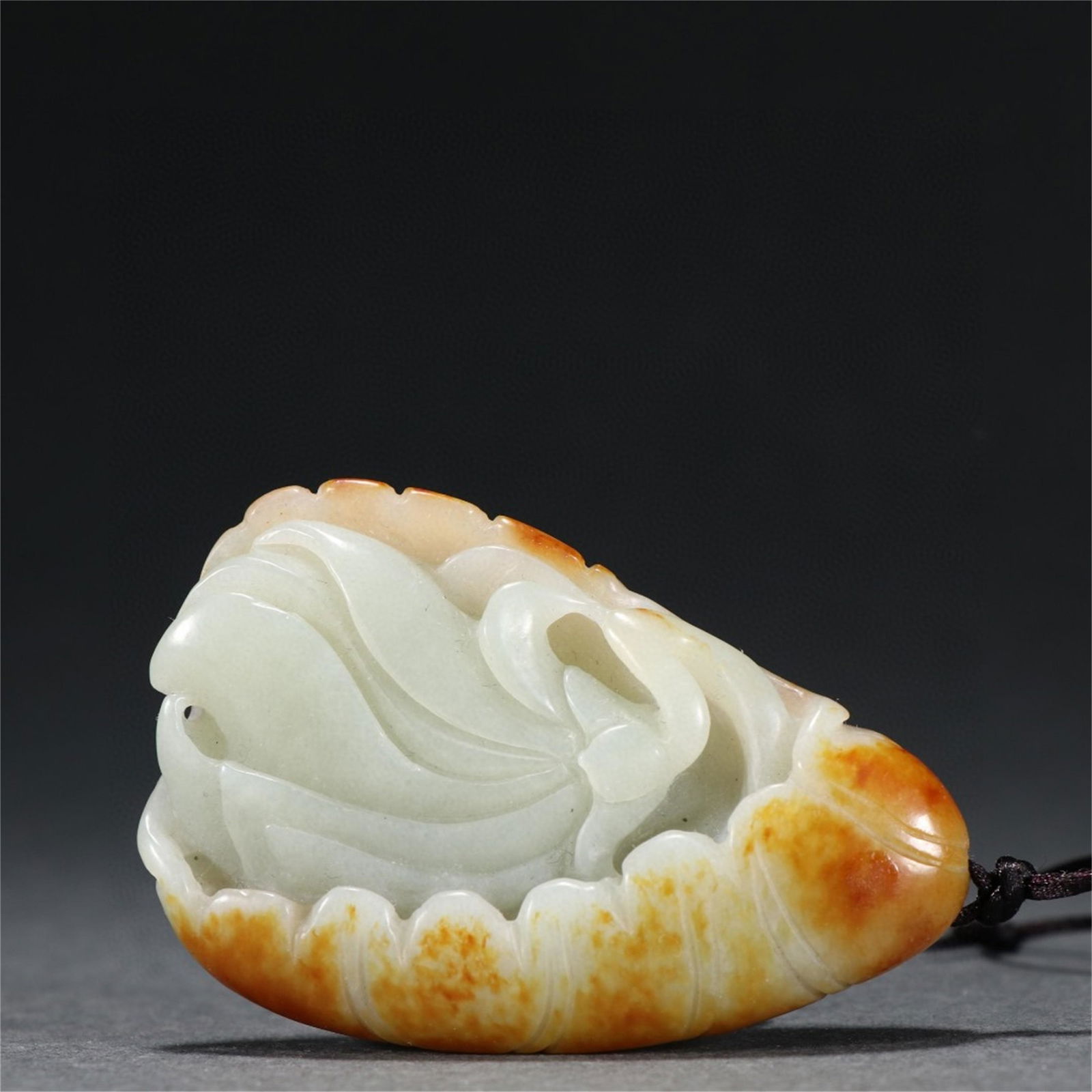 A Chinese Carved Jade Lotus Shaped Pendant (1 of 9)