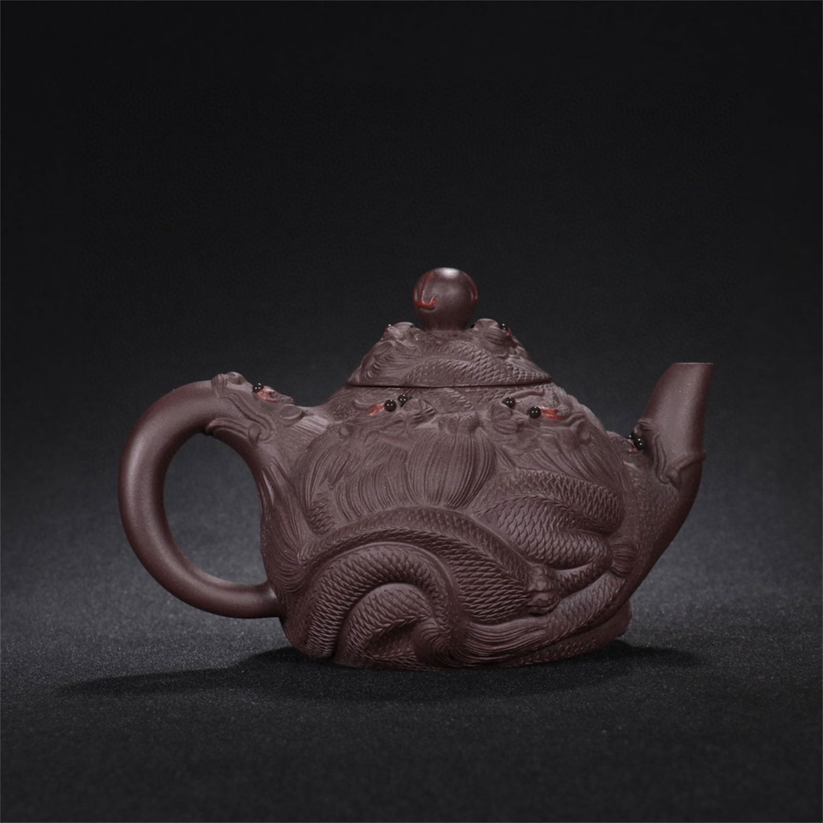 A Chinese Yixing Zisha Dragon Patterned Teapot (1 of 9)
