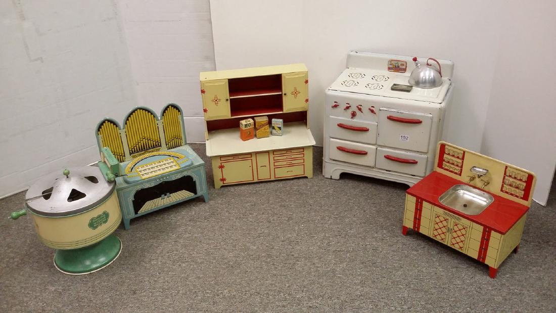 5 child's appliances including Wolverine crank organ,: 5 child's appliances including Wolverine crank organ, Pretty Maid stove, Sunny Suzy washing machine, a sink & a cupboard
