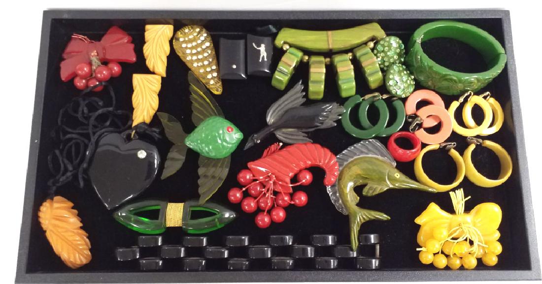 Group of bakelite jewelry including carved clamper (1 of 4)