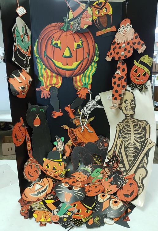 Large group of die-cut Halloween decorations & some: Large group of die-cut Halloween decorations & some jointed masks, etc. (some as seen)