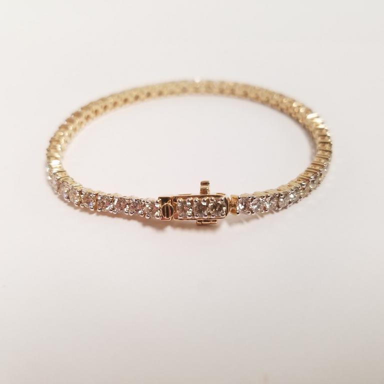 14k gold and diamond tennis bracelet - 55 diamonds -: 14k gold and diamond tennis bracelet - 55 diamonds - 7.08 tcw - 7 1/4" long - 12.9 grams