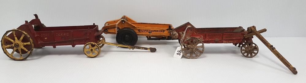 3 manure spreaders - John Deere 9" long; Arcade McCormick  8" long (as is) & Arcade Oliver 7 (1 of 10)