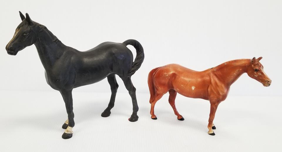2 cast iron doorstops - black horse 12" long & brown horse 10 1/2" long: 2 cast iron doorstops - black horse 12" long & brown horse 10 1/2" long
