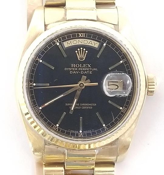 Rolex 18K Presidential gold oyster perpetual day date mens wristwatch with black dial serial #: Rolex 18K Presidential gold oyster perpetual day date mens wristwatch with black dial serial # 8383008; 35mm; 135.5 grams with movement