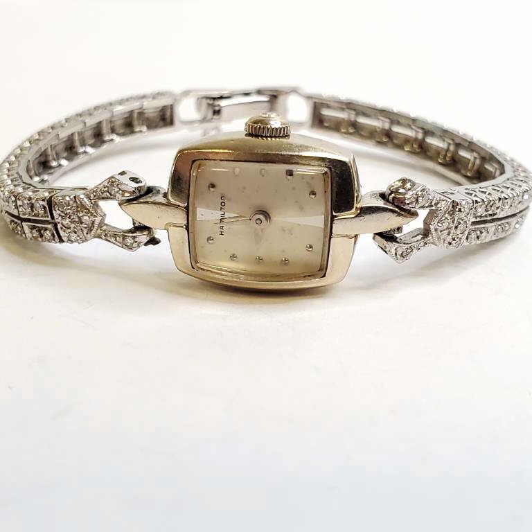 14K gold Hamilton ladies watch with 14K white gold band encrusted with diamonds - 20.5 grams total: 14K gold Hamilton ladies watch with 14K white gold band encrusted with diamonds - 20.5 grams total weight including the movement; 5 3/4" long
