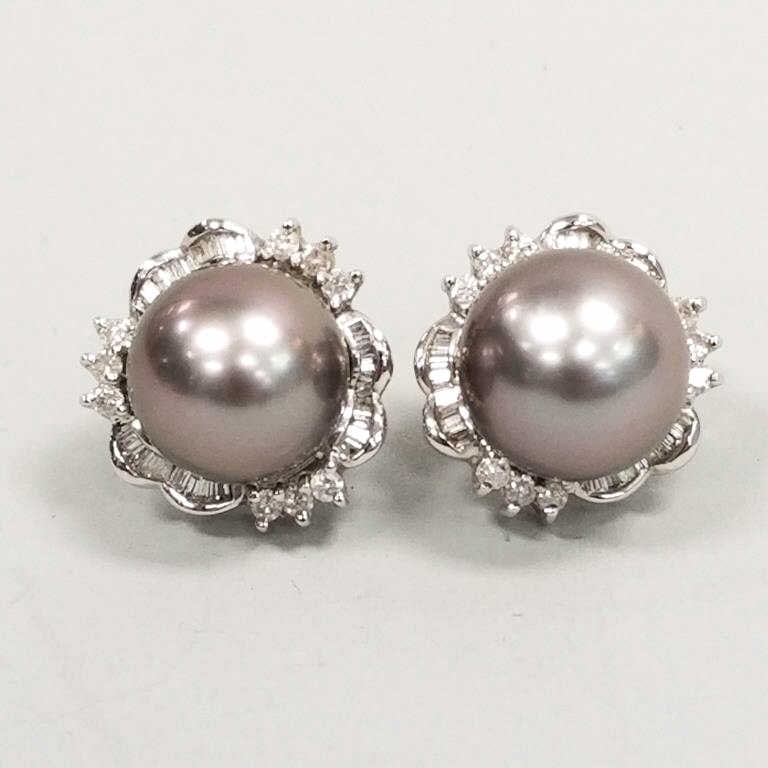 Pair of 14K white gold earrings set with 11mm Tahitian pearls with baguette and round diamond (1 of 6)