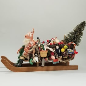 Antique German Santa on 14" long sleigh with antique & newer toy items