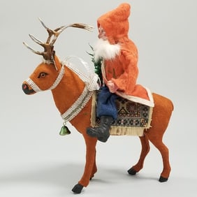 Antique German reindeer candy container with newer additions 7"  with a composition Santa 7" high