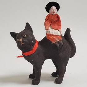 Antique 5 3/4" German papier-mache black cat candy container with witch riding on back (broom in 2