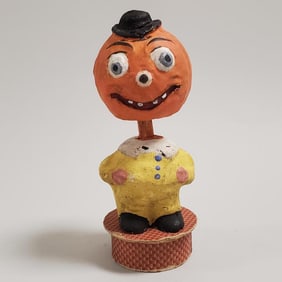 Vintage 5 1/2" German pumpkin nodder on candy box (maybe some paint touch up to face)
