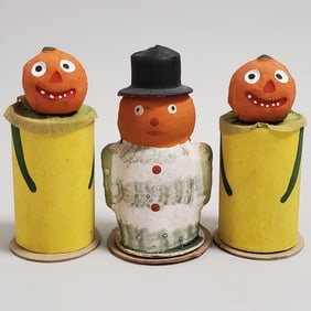 3 vintage German candy containers: two 3 1/4" pumpkin heads & one 3 1/4" veggie man with hat