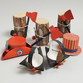 7 asst. vintage patriotic candy containers: 3 logs with axes & 4 hats- 3 1/2" tallest