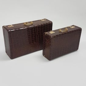 Two piece Loyal faux alligator leather clad luggage with bakelite handles and canvas outer covers