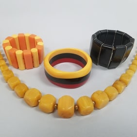 4 pcs. Bakelite, etc. jewelry: 3 bracelets & a 28"L necklace - 8 1/8" bangle bracelet interior