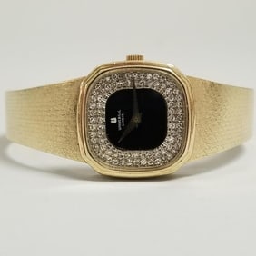 14k gold Universal Geneve wristwatch with diamond encrusted black dial & 14k gold band- 43.2 grams