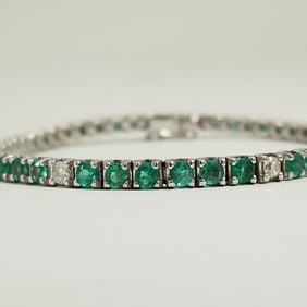 18K white gold emerald & diamond tennis bracelet approx. 3mm stones - 14.3 grams; 6 3/4" length
