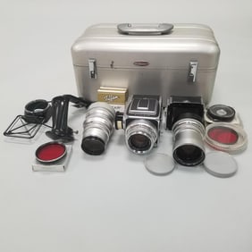 Hasselblad 500C camera w/ Zeiss lenses in case with accessories, booklets, paperwork, etc.