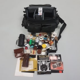 Group of assorted vintage camera accessories including Leica, etc. lens, manuals, filters & camera