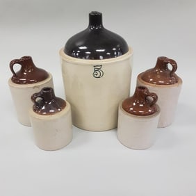 5 vintage stoneware jugs - assorted sizes including 5 gallon (some with chips)