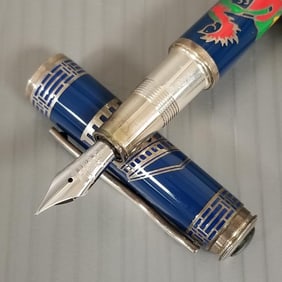Omas The Trip of The Phoenix fountain pen: sterling silver, blue enamel, & jade cabochon cap w/ 18k