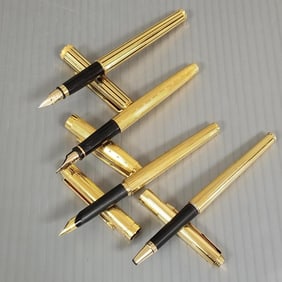 4 assorted Parker gold tone pens: incl. 3 fountain pens - 2 w/ 18k gold nibs in a Parker box