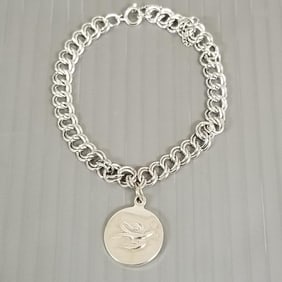 Towle sterling silver 1971 partridge in a pear tree & peace dove charm bracelet: 7"L, 3/4" charm