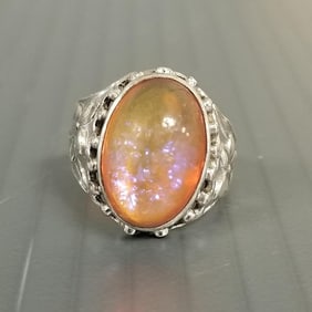 Vintage sterling silver ring w/ dragon's breath glass cabochon in floral motif mount - 3/4" @