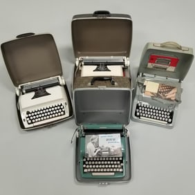 4 mid-century typewriters in cases including Hermes, etc.