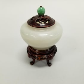 Small signed jade bowl with pierced wood lid on wood stand- 3 1/2"H 2 1/4"W OD assembled