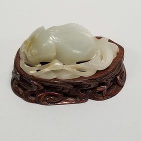 Carved jade fish on carved wood stand- 1 1/2"H 3"W 1 3/4"D OD assembled