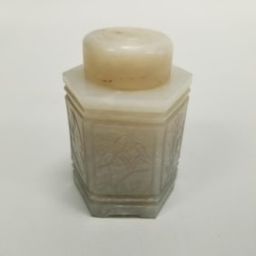 Carved jade hexagonal jar with lid on carved wood stand- 3 5/8"H 2 1/4"W OD assembled (stone
