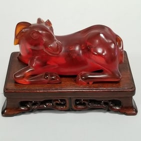 Carved cherry amber reclining goat on carved wood stand- 2 1/2"H 2 1/4"W 4"L assembled OD
