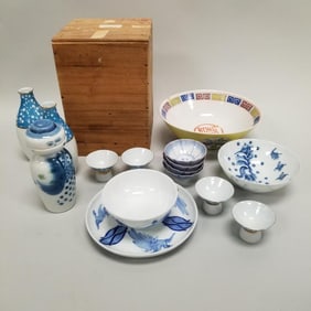 Group Asian porcelain incl Saki set, large & small bowls, figural bottle, crate, etc. some