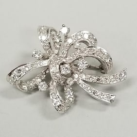 Tested 10K white gold bow knot brooch set with many diamonds- 6.1 grams, 1 1/4"L