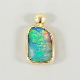 Tested 18K gold & opal pendant 7.5, 1 1/8" total length (opal has intense blue, green, orange/ red