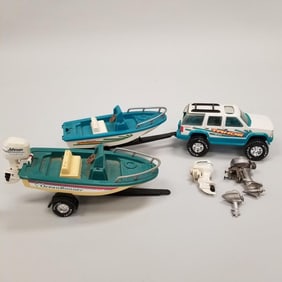 Gp incl a Sea Fury toy outboard motor (as is- froze, no spark plug), 2 plastic boats w/ Johnson toy