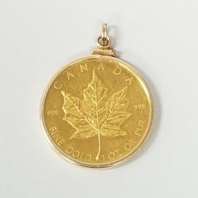 1980- 1oz. gold maple leaf coin in 14k gold bezel: 33.6g total