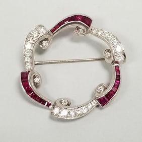 18K white gold, diamond & ruby circle brooch: 9.8g 1 1/4" diameter- approx. 1.0 tcw diamonds