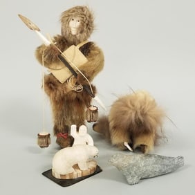 4 Inuit items: two fur dolls, carved stone seal & carved fossilized sculpture- 9"H 6"W 2 1/2"D