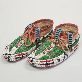 Pair antique Native American beaded moccasins, w/ tinkle cones- 3 3/4"H 10 1/2"L 4"W