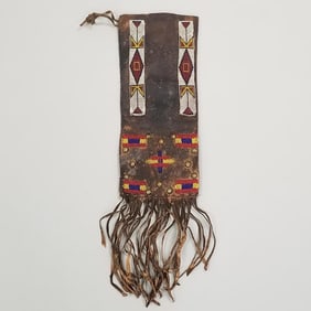 Leather fringed pipe bag with beadwork & applied brass tacks- approx. 24" x 6 1/2" OD including