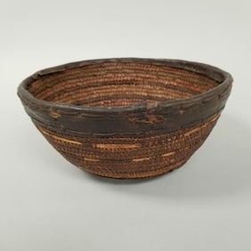 Old woven basket with University Museum number- 4 1/2"H 10"D (as seen- leather losses, etc.)