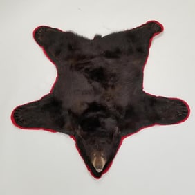 Black bear rug with claws approx. 5' x 5 1/2' (as seen- some losses, moth damage, etc)