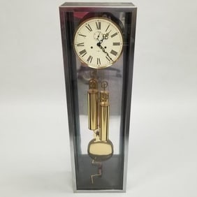 Howard Miller mid-century wall clock- 42 1/8"H 12 3/4"W 8 1/4"D