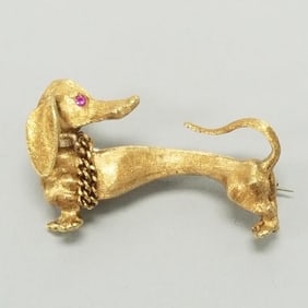 18K gold Dachshund pin with ruby eyes: 10.5 grams, 1 3/8" L