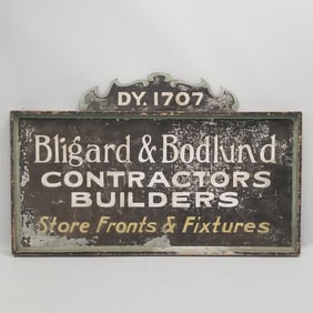 Large antique painted tin advertising sign in wooden frame "Bligard & Bodlund Contractors &